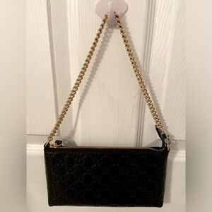 Gucci black leather bag with gold chain